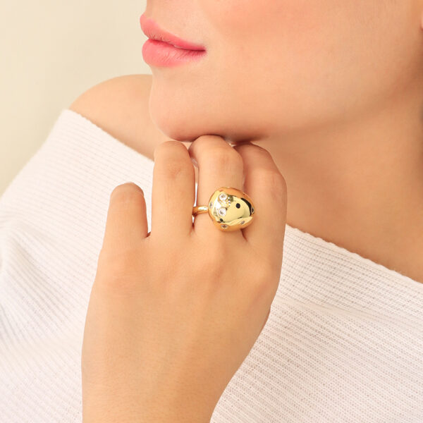 ANILLO .  CRISTAL EN BAÑO DE ORO