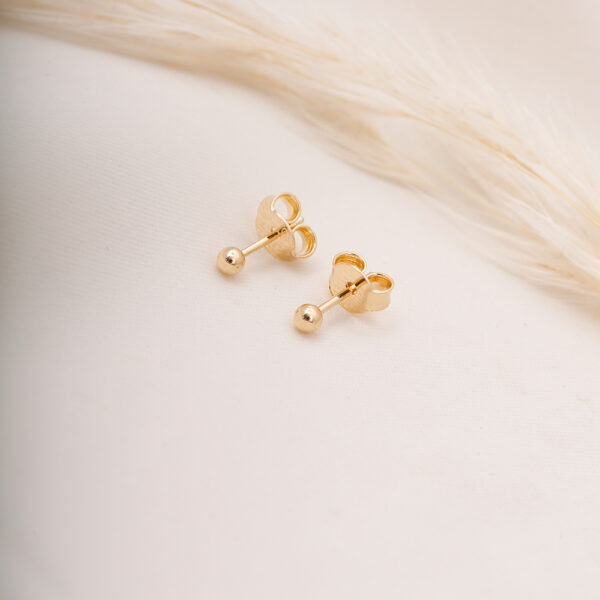 TOPO BORLA Y POMPON EN ORO LAMINADO