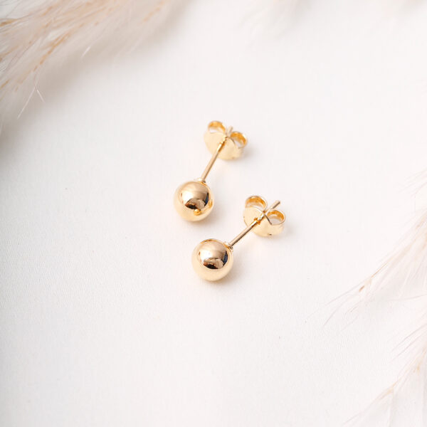 TOPO BORLA Y POMPON EN ORO LAMINADO
