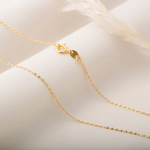 CADENA . FIGURAS EN ORO LAMINADO
