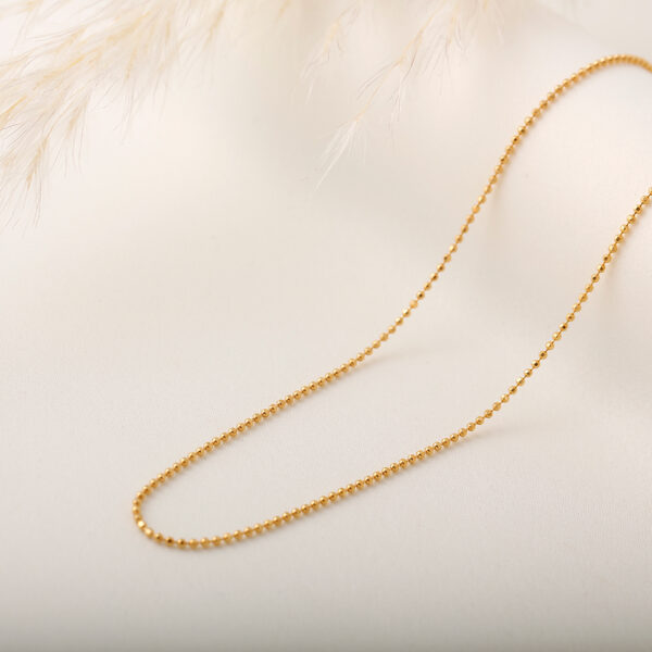 CADENA . CRISTAL- BALIN EN ORO LAMINADO