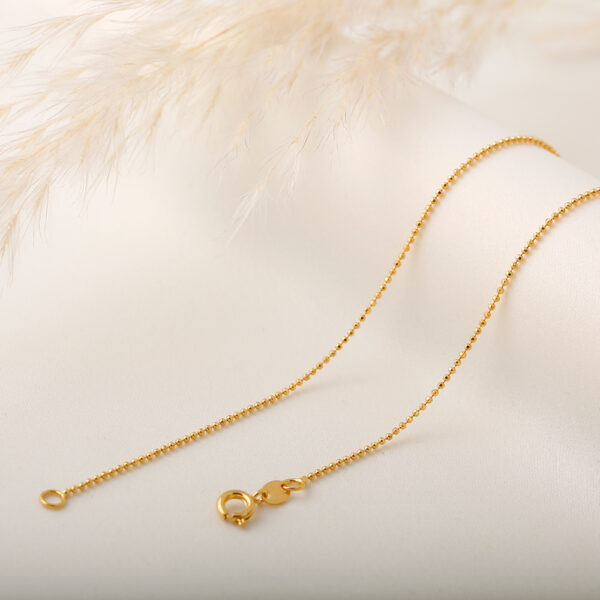 CADENA . CRISTAL- BALIN EN ORO LAMINADO