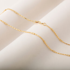 CADENA . FIGURAS EN ORO LAMINADO