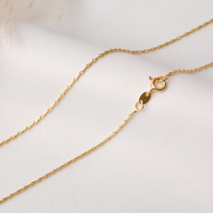 CADENA . FIGURAS EN ORO LAMINADO