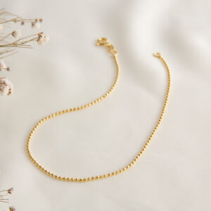 TOBILLERA . BORLA Y POMPON EN ORO LAMINADO