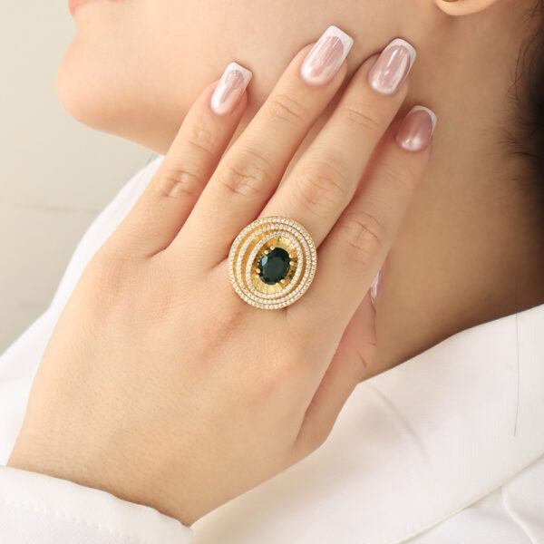 ANILLO .  CRISTAL EN BAÑO DE ORO