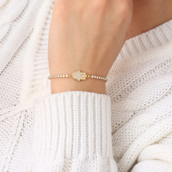 PULSERA  C/ DIJES Y PIEDRAS EN BAÑO DE ORO