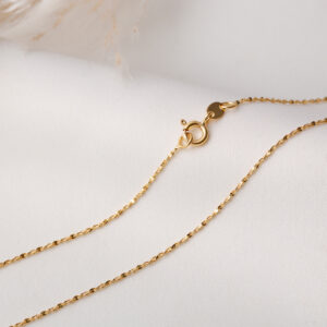 CADENA . FIGURAS EN ORO LAMINADO