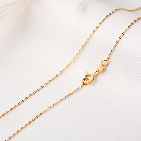 CADENA . FIGURAS EN ORO LAMINADO