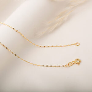 CADENA . FIGURAS EN ORO LAMINADO