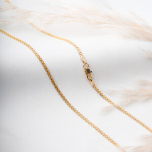 CADENA . LONG CURB EN ORO LAMINADO