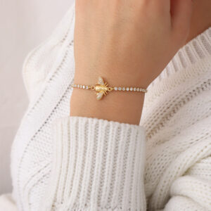 PULSERA .  DIJES Y PIEDRAS EN BANO DE ORO