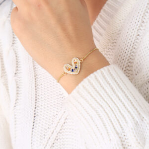 PULSERA .  DIJES Y PIEDRAS EN BANO DE ORO