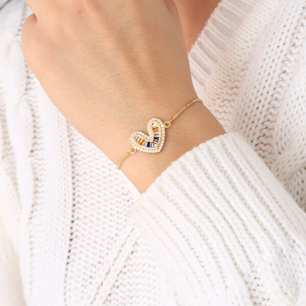 PULSERA .  DIJES Y PIEDRAS EN BANO DE ORO