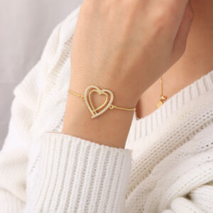 PULSERA .  DIJES Y PIEDRAS EN BANO DE ORO
