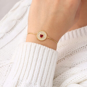 PULSERA .  DIJES Y PIEDRAS EN BANO DE ORO