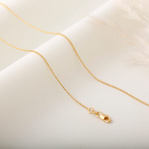 CADENA . CRISTAL- BALIN EN ORO LAMINADO