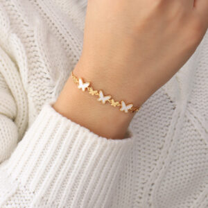 PULSERA . FLAUTAS METALICAS EN BAÑO DE ORO